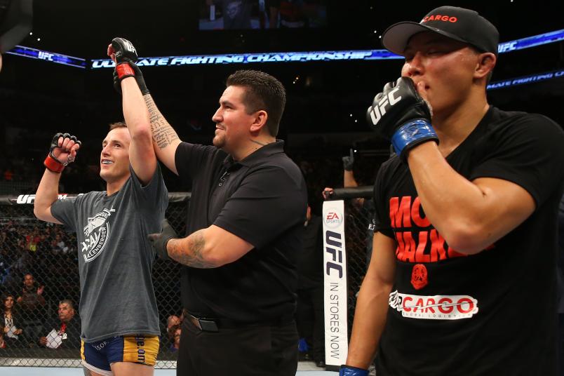 Joe Ellenberger (left) reacts to his victory over James Moontasri (right) in their lightweight bout at the AT&T Center on June 28, 2014 in San Antonio, Texas. (Photo by Ed Mulholland/Zuffa LLC via Getty Images)