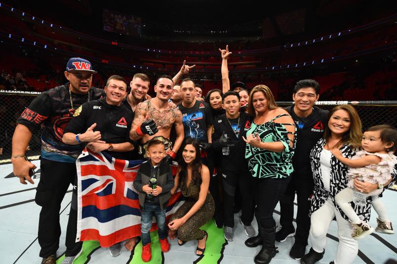 DETROIT, MI - DECEMBER 02: UFC featherweight champion Max Holloway celebrates with his family, teammates and coaches after defeating Jose Aldo of Brazil in their UFC featherweight championship bout during the UFC 218 event inside Little Caesars Arena on December 02, 2017 in Detroit, Michigan. (Photo by Josh Hedges/Zuffa LLC/Zuffa LLC via Getty Images)