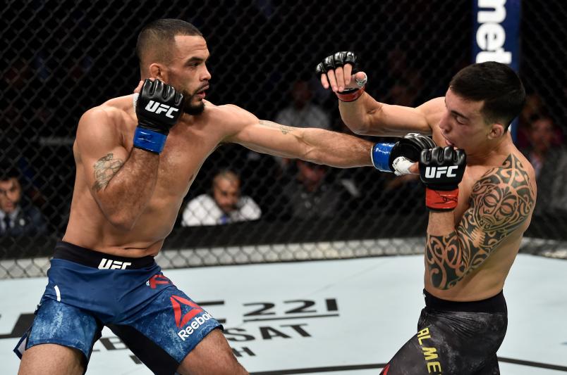 BOSTON, MA - JANUARY 20:  (L-R) Rob Font punches Thomas Almeida of Brazil in their bantamweight bout during the UFC 220 event at TD Garden on January 20, 2018 in Boston, Massachusetts. (Photo by Jeff Bottari/Zuffa LLC/Zuffa LLC via Getty Images)