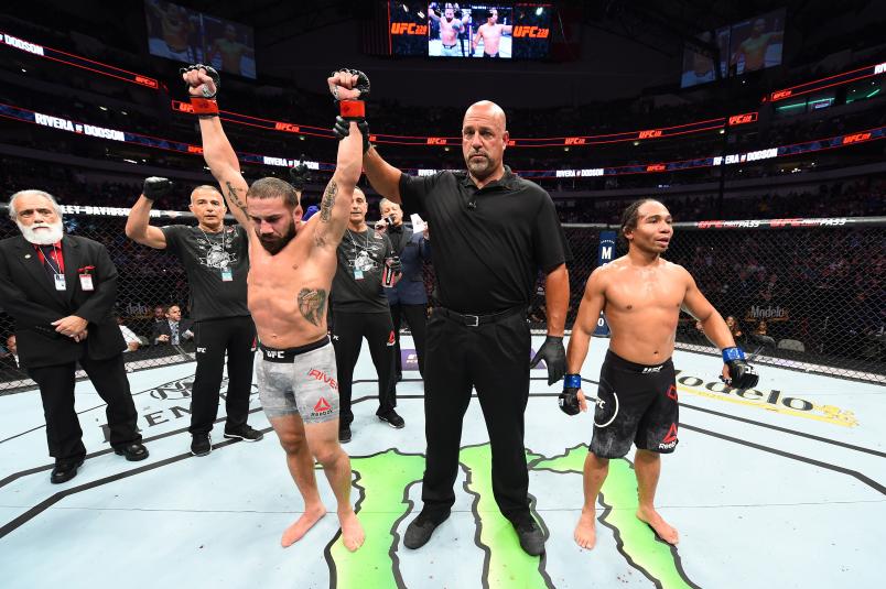 DALLAS, TX - SEPTEMBER 08: (L-R) Jimmie Rivera celebrates after defeating John Dodson by unanimous decision in their bantamweight fight during the UFC 228 event at American Airlines Center on September 8, 2018 in Dallas, Texas. (Photo by Josh Hedges/Zuffa LLC/Zuffa LLC via Getty Images)