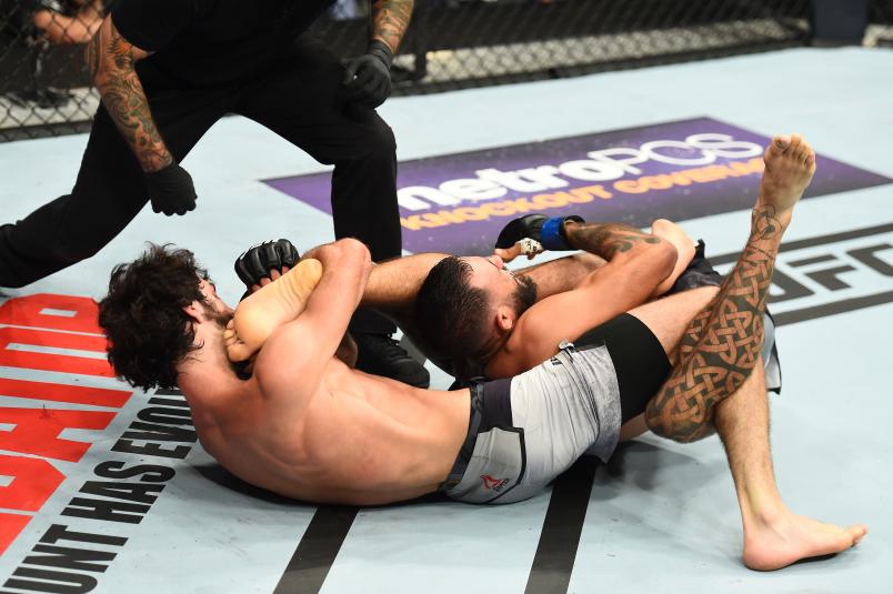 DALLAS, TX - SEPTEMBER 08: (L-R) Zabit Magomedsharipov of Russia attempts to submits Brandon Davis in their featherweight fight during the UFC 228 event at American Airlines Center on September 8, 2018 in Dallas, Texas. (Photo by Josh Hedges/Zuffa LLC/Zuffa LLC via Getty Images)