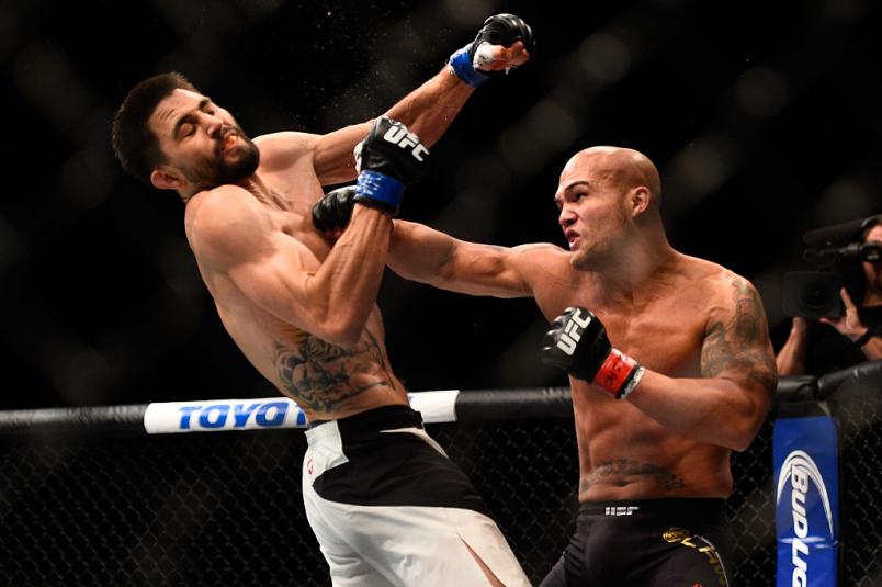 Robbie Lawler punches Carlos Condit in their UFC welterweight championship bout during the UFC 195 event inside MGM Grand Garden Arena on January 2, 2016 in Las Vegas, Nevada. (Photo by Jeff Bottari/Zuffa LLC/Zuffa LLC via Getty Images)