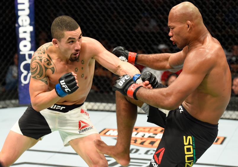 KANSAS CITY, MO - APRIL 15: (L-R) Robert Whittaker of New Zealand punches Jacare Souza of Brazil in their middleweight fight during the UFC Fight Night event at Sprint Center on April 15, 2017 in Kansas City, Missouri. (Photo by Josh Hedges/Zuffa LLC/Zuffa LLC via Getty Images)