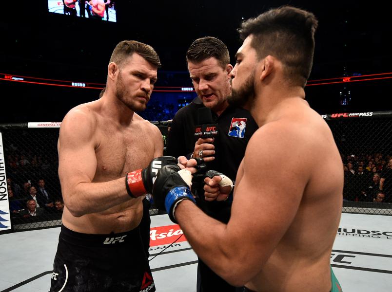 SHANGHAI, CHINA - NOVEMBER 25: (L-R) Opponents Michael Bisping of England and Kelvin Gastelum face offprior to their middleweight bout during the UFC Fight Night event inside the Mercedes-Benz Arena on November 25, 2017 in Shanghai, China. (Photo by Brandon Magnus/Zuffa LLC via Getty Images)