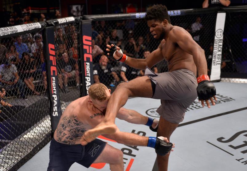 LAS VEGAS, NV - AUGUST 07: (R-L) Kennedy Nzechukwu kicks Dennis Bryant in their light heavyweight fight during Dana White's Tuesday Night Contender Series at the TUF Gym on August 7, 2018 in Las Vegas, Nevada. (Photo by Chris Unger/DWTNCS LLC)