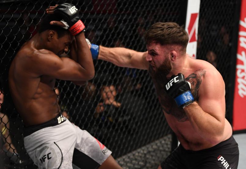 BEIJING, CHINA - NOVEMBER 24: (R-L) John Phillips of Wales punches Kevin Holland in their middleweight bout during the UFC Fight Night event inside Cadillac Arena on November 24, 2018 in Beijing, China. (Photo by Jeff Bottari/Zuffa LLC/Zuffa LLC via Getty Images)