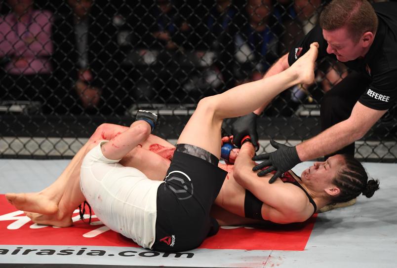 BEIJING, CHINA - NOVEMBER 24: (R-L) Weili Zhang of China secures an arm bar submission against Jessica Aguilar in their women's strawweight bout during the UFC Fight Night event inside Cadillac Arena on November 24, 2018 in Beijing, China. (Photo by Jeff Bottari/Zuffa LLC/Zuffa LLC via Getty Images)