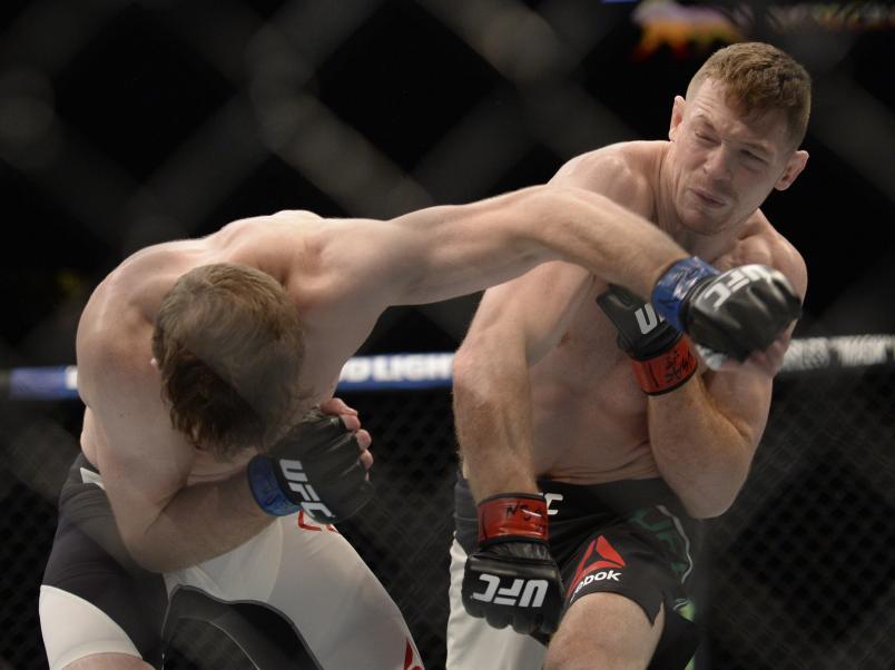 LAS VEGAS, NV - JULY 07: (R-L) Joe Duffy of Ireland punches Mitch Clarke of Canada in their lightweight bout during the UFC Fight Night event inside the MGM Grand Garden Arena on July 7, 2016 in Las Vegas, Nevada. (Photo by Brandon Magnus/Zuffa LLC/Zuffa LLC via Getty Images)