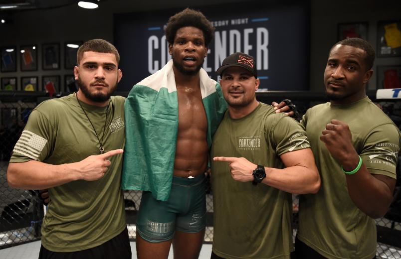 LAS VEGAS, NV - AUGUST 22: Kennedy Nzechukwu poses with his team after his split-decision victory over Anton Berzin of Ukraine in their light heavyweight bout during Dana White's Tuesday Night Contender Series at the TUF Gym on August 22, 2017 in Las Vegas, Nevada. (Photo by Brandon Magnus/DWTNCS)