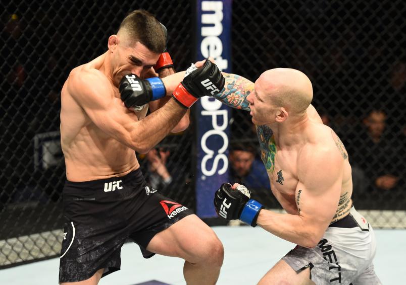 WINNIPEG, CANADA - DECEMBER 16: (R-L) Josh Emmett punches Ricardo Lamas in their featherweight bout during the UFC Fight Night event at Bell MTS Place on December 16, 2017 in Winnipeg, Manitoba, Canada. (Photo by Josh Hedges/Zuffa LLC/Zuffa LLC via Getty Images)
