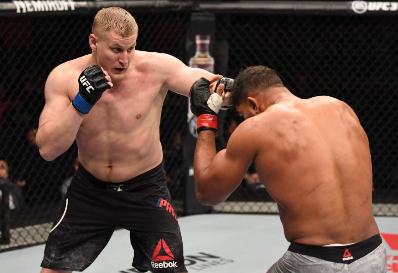 BEIJING, CHINA - NOVEMBER 24: (L-R) Sergei Pavlovich of Russia punches Alistair Overeem of The Netherlands in their heavyweight bout during the UFC Fight Night event inside Cadillac Arena on November 24, 2018 in Beijing, China. (Photo by Jeff Bottari/Zuffa LLC/Zuffa LLC via Getty Images)