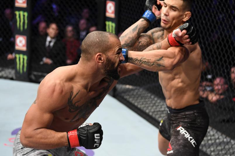 TORONTO, CANADA - DECEMBER 08: (L-R) Devin Clark punches Aleksandar Rakic of Austria in their light heavyweight fight during the UFC 231 event at Scotiabank Arena on December 8, 2018 in Toronto, Canada. (Photo by Josh Hedges/Zuffa LLC/Zuffa LLC via Getty Images)