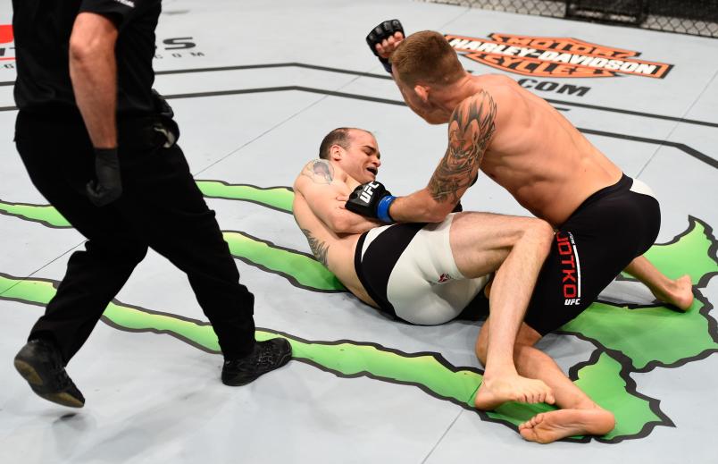 OTTAWA, ON - JUNE 18: (R-L) Krzysztof Jotko of Poland punches Tamdan McCrory in their middleweight bout during the UFC Fight Night event inside the TD Place Arena on June 18, 2016 in Ottawa, Ontario, Canada. (Photo by Jeff Bottari/Zuffa LLC/Zuffa LLC via Getty Images)