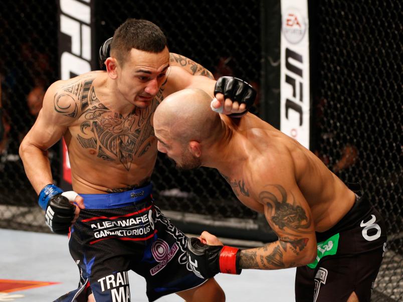 STOCKHOLM, SWEDEN - OCTOBER 04: (L-R) Max Holloway punches Akira Corassani of Sweden in their featherweight bout at the Ericsson Globe Arena on October 4, 2014 in Stockholm, Sweden. (Photo by Josh Hedges/Zuffa LLC/Zuffa LLC)