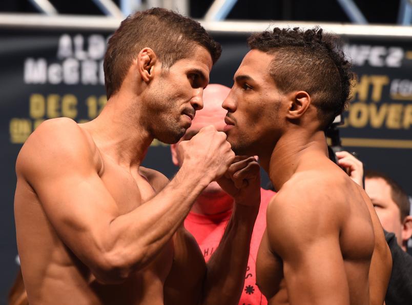 LAS VEGAS, NV - DECEMBER 11: (L-R) Opponents Leonardo Santos of Brazil and Kevin Lee face off during the UFC 194 weigh-in inside MGM Grand Garden Arena on December 10, 2015 in Las Vegas, Nevada. (Photo by Josh Hedges/Zuffa LLC/Zuffa LLC via Getty Images)