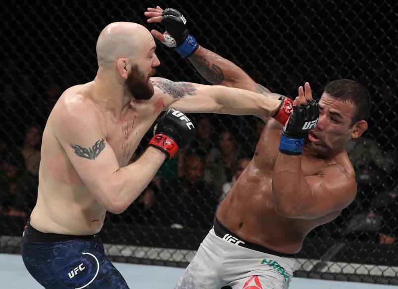 SANTIAGO, CHILE - MAY 19: (L-R) Zak Cummings punches Michel Prazeres of Brazil in their welterweight bout during the UFC Fight Night event at Movistar Arena on May 19, 2018 in Santiago, Chile. (Photo by Buda Mendes/Zuffa LLC/Zuffa LLC via Getty Images)
