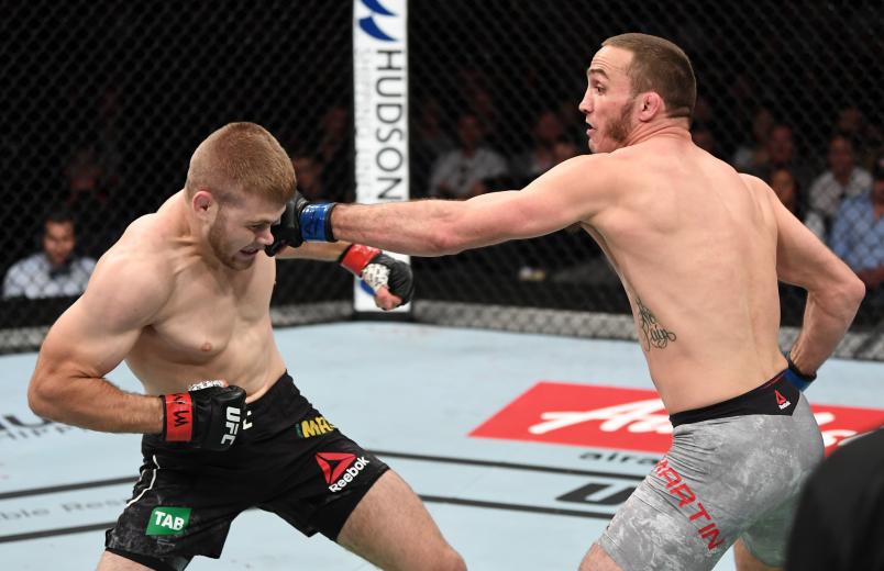 ADELAIDE, AUSTRALIA - DECEMBER 02: (R-L) Anthony Martin punches Jake Matthews of Australia in their welterweight bout during the UFC Fight Night event inside Adelaide Entertainment Centre on December 2, 2018 in Adelaide, Australia. (Photo by Jeff Bottari/Zuffa LLC/Zuffa LLC via Getty Images)