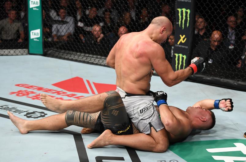 ADELAIDE, AUSTRALIA - DECEMBER 02: (L-R) Junior Dos Santos of Brazil punches Tai Tuivasa of Australia in their heavyweight bout during the UFC Fight Night event inside Adelaide Entertainment Centre on December 2, 2018 in Adelaide, Australia. (Photo by Jeff Bottari/Zuffa LLC/Zuffa LLC via Getty Images)