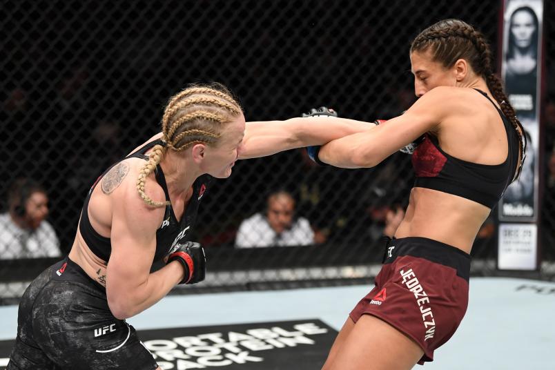 Valentina Shevchenko of Kyrgyzstan punches Joanna Jedrzejczyk of Poland in their UFC strawweight championship fight during the UFC 231 event at Scotiabank Arena on December 8, 2018 in Toronto, Canada. (Photo by Josh Hedges/Zuffa LLC via Getty Images)