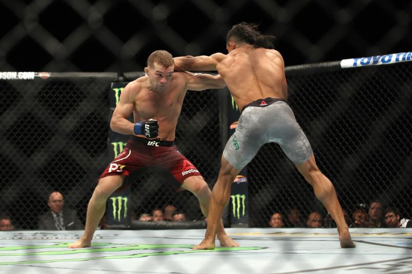 INGLEWOOD, CA - DECEMBER 29: (L-R) Petr Yan of Russia punches Douglas Silva de Andrade of Brazil in their bantamweight bout during the UFC 232 event inside The Forum on December 29, 2018 in Inglewood, California. (Photo by Christian Petersen/Zuffa LLC/Zuffa LLC via Getty Images)