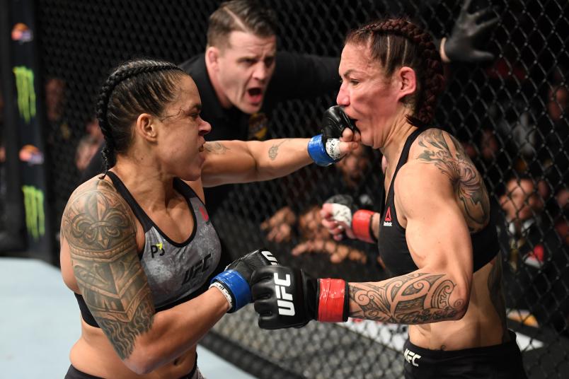 INGLEWOOD, CA - DECEMBER 29: (L-R) Amanda Nunes of Brazil punches Cris Cyborg of Brazil in their women's featherweight bout during the UFC 232 event inside The Forum on December 29, 2018 in Inglewood, California. (Photo by Josh Hedges/Zuffa LLC/Zuffa LLC via Getty Images)