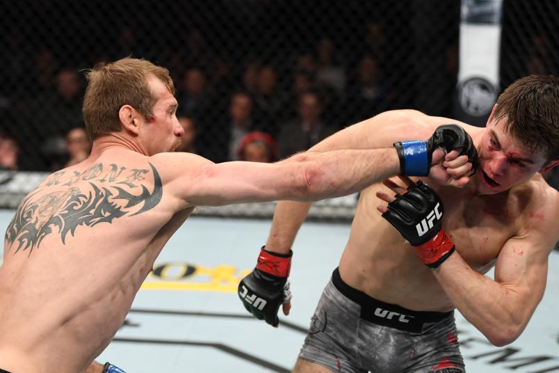 NEW YORK, NY - JANUARY 19: (L-R) Donald Cerrone punches Alexander Hernandez in their lightweight bout during the UFC Fight Night event at the Barclays Center on January 19, 2019 in the Brooklyn borough of New York City. (Photo by Josh Hedges/Zuffa LLC/Zuffa LLC via Getty Images)