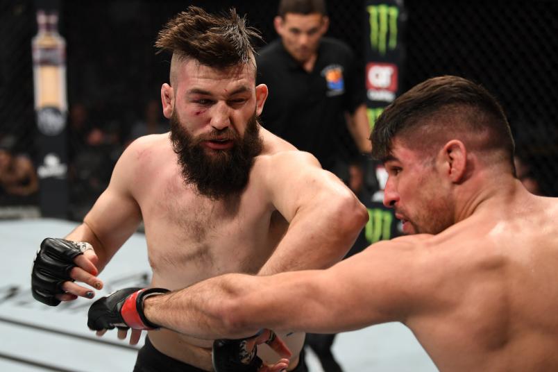 PHOENIX, ARIZONA - FEBRUARY 17: (L-R) Bryan Barberena elbows Vicente Luque in their welterweight bout during the UFC Fight Night event at Talking Stick Resort Arena on February 17, 2019 in Phoenix, Arizona. (Photo by Josh Hedges/Zuffa LLC/Zuffa LLC via Getty Images)
