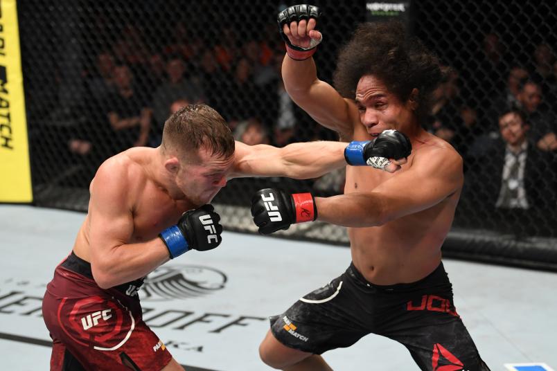 PRAGUE, CZECH REPUBLIC - FEBRUARY 23: (L-R) Petr Yan of Russia punches John Dodson in their bantamweight bout during the UFC Fight Night event at O2 Arena on February 23, 2019 in the Prague, Czech Republic. (Photo by Jeff Bottari/Zuffa LLC/Zuffa LLC via Getty Images)