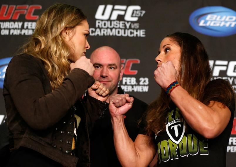 ANAHEIM, CA - FEBRUARY 21: (L-R) Opponents Ronda Rousey and Liz Carmouche face off during a UFC pre-fight press conference at Honda Center on February 21, 2013 in Anaheim, California. (Photo by Josh Hedges/Zuffa LLC/Zuffa LLC via Getty Images)