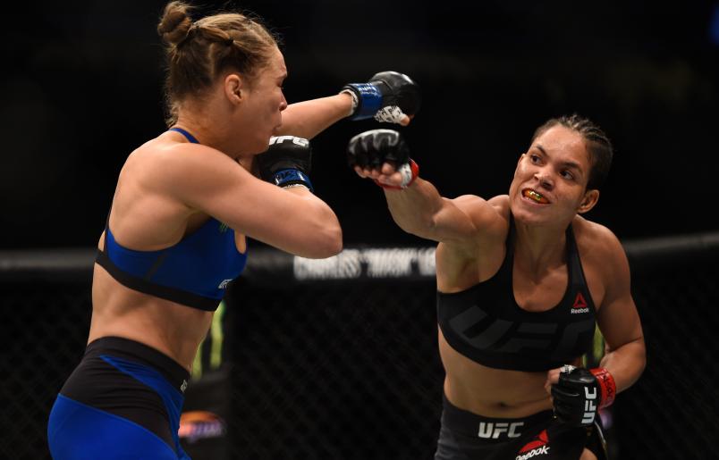 LAS VEGAS, NV - DECEMBER 30: (R-L) Amanda Nunes of Brazil punches Ronda Rousey in their UFC women's bantamweight championship bout during the UFC 207 event at T-Mobile Arena on December 30, 2016 in Las Vegas, Nevada. (Photo by Jeff Bottari/Zuffa LLC/Zuffa LLC via Getty Images)