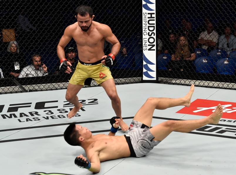 FEBRUARY 11: (L-R) Jussier Formiga of Brazil knocks down Ben Nguyen in their flyweight bout during the UFC 221 event at Perth Arena on February 11, 2018 in Perth, Australia. (Photo by Jeff Bottari/Zuffa LLC via Getty Images)