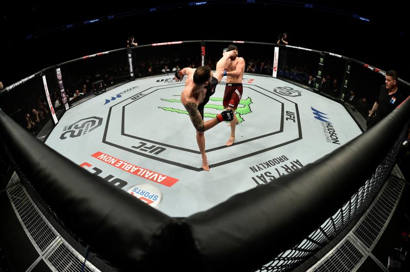LONDON, ENGLAND - MARCH 17: (L-R) Paul Craig of Scotland kicks Magomed Ankalaev in their light heavyweight bout inside The O2 Arena on March 17, 2018 in London, England. (Photo by Brandon Magnus/Zuffa LLC/Zuffa LLC via Getty Images)