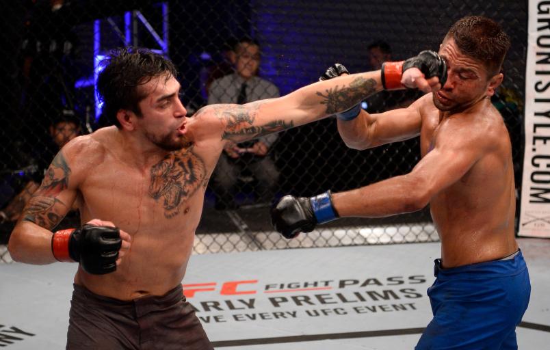LAS VEGAS, NV - JULY 10: (L-R) Kevin Aguilar punches Joey Gomez in their lightweight bout during Dana White's Tuesday Night Contender Series at the TUF Gym on July 10, 2018 in Las Vegas, Nevada. (Photo by Chris Unger/DWTNCS LLC)