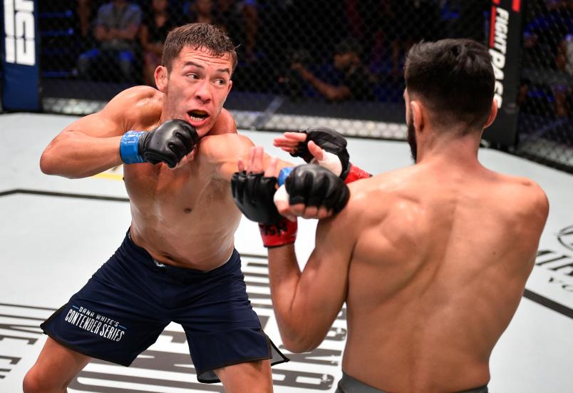 LAS VEGAS, NV - JULY 09: (L-R) Hunter Azure punches Christian Ocon in their bantamweight bout during Dana White's Contender Series at the UFC Apex on July 9, 2019 in Las Vegas, Nevada. (Photo by Chris Unger/DWCS LLC)