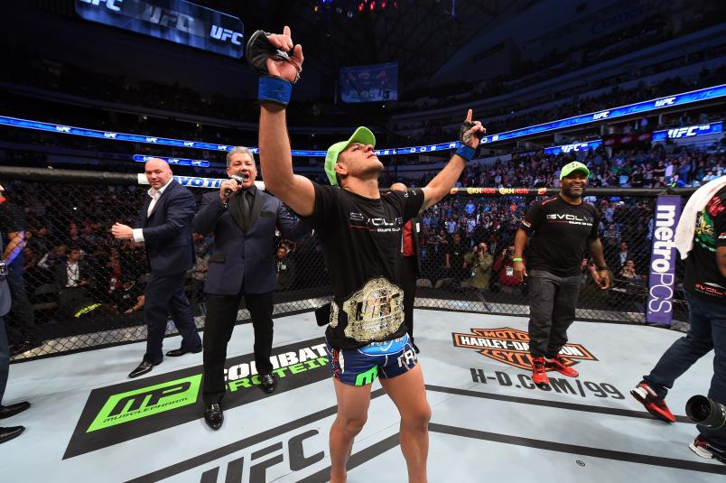 DALLAS, TX - MARCH 14: Rafael dos Anjos of Brazil celebrates after being announced the new UFC Lightweight Champion after defeating Anthony Pettis in their UFC lightweight championship bout during the UFC 185 event at the American Airlines Center on March 14, 2015 in Dallas, Texas. (Photo by Josh Hedges/Zuffa LLC/Zuffa LLC via Getty Images)