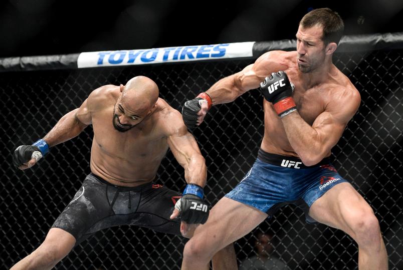 PITTSBURGH, PA - SEPTEMBER 16: (R-L) Luke Rockhold punches David Branch in their middleweight bout during the UFC Fight Night event inside the PPG Paints Arena on September 16, 2017 in Pittsburgh, Pennsylvania. (Photo by Brandon Magnus/Zuffa LLC/Zuffa LLC via Getty Images)