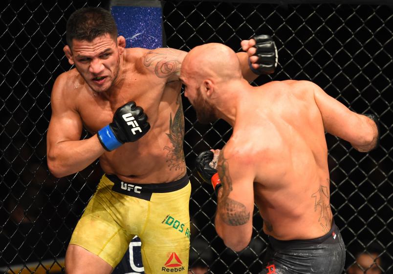 WINNIPEG, CANADA - DECEMBER 16: (L-R) Rafael Dos Anjos of Brazil punches Robbie Lawler in their welterweight bout during the UFC Fight Night event at Bell MTS Place on December 16, 2017 in Winnipeg, Manitoba, Canada. (Photo by Josh Hedges/Zuffa LLC/Zuffa LLC via Getty Images)