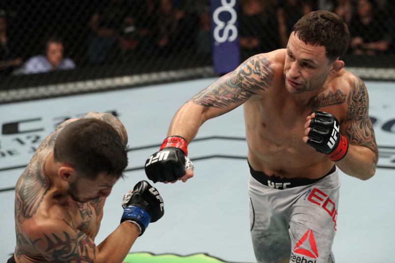  Frankie Edgar punches Cub Swanson in their featherweight fight during the UFC Fight Night event at the Boardwalk Hall on April 21, 2018 in Atlantic City, New Jersey. (Photo by Patrick Smith/Zuffa LLC/Zuffa LLC via Getty Images)