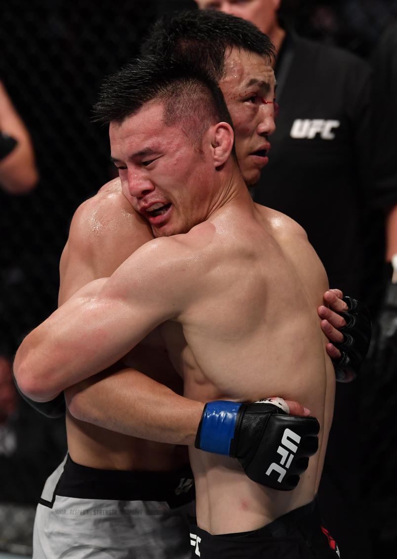 Danaa Batgerel of Mongolia and Alatengheili of China hug after their bantamweight bout during the UFC Fight Night event at Shenzhen Universiade Sports Centre on August 31, 2019 in Shenzhen, China. (Photo by Brandon MagnusZuffa LLCZuffa LLC)
