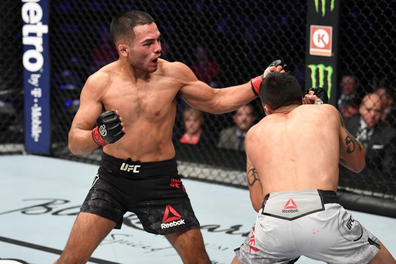 DENVER, CO - NOVEMBER 10: (L-R) Mark De La Rosa punches Joby Sanchez in their bantamweight bout during the UFC Fight Night event inside Pepsi Center on November 10, 2018 in Denver, Colorado. (Photo by Josh Hedges/Zuffa LLC/Zuffa LLC via Getty Images)