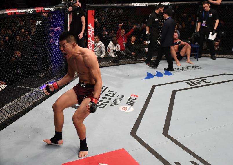 BEIJING, CHINA - NOVEMBER 24: Li Jingliang of China celebrates after his TKO victory over David Zawada of Germany in their welterweight bout during the UFC Fight Night event inside Cadillac Arena on November 24, 2018 in Beijing, China. (Photo by Jeff Bottari/Zuffa LLC/Zuffa LLC via Getty Images)