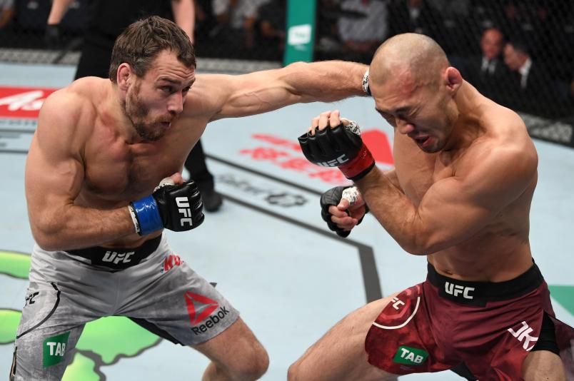 Aleksei Kunchenko of Russia punches Yushin Okami of Japan in their welterweight bout during the UFC Fight Night event inside Adelaide Entertainment Centre on December 2, 2018 in Adelaide, Australia. (Photo by Jeff Bottari/Zuffa LLC via Getty Images)
