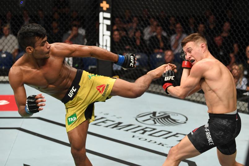 MELBOURNE, AUSTRALIA - FEBRUARY 10: (L-R) Raulian Paiva of Brazil kicks Kai Kara France of New Zealand in their flyweight bout during the UFC 234 at Rod Laver Arena on February 10, 2019 in the Melbourne, Australia. (Photo by Jeff Bottari/Zuffa LLC)