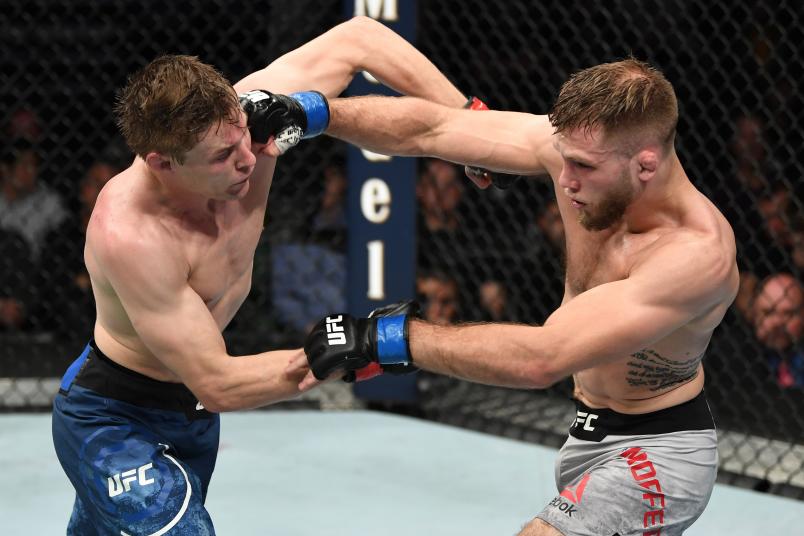 NASHVILLE, TENNESSEE - MARCH 23: (R-L) Bobby Moffett punches Bryce Mitchell in their featherweight bout during the UFC Fight Night event at Bridgestone Arena on March 23, 2019 in Nashville, Tennessee. (Photo by Jeff Bottari/Zuffa LLC)