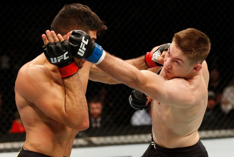 ROCHESTER, NY - MAY 18: (R-L) Derrick Krantz and Vicente Luque of Brazil trade punches in their welterweight bout during the UFC Fight Night event at Blue Cross Arena on May 18, 2019 in Rochester, New York. (Photo by Michael Owens/Zuffa LLC/Zuffa LLC via Getty Images)