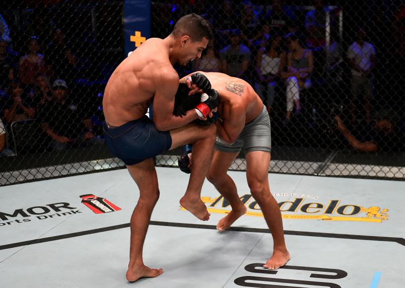 Miguel Baeza knees Victor Reyna in their welterweight bout during Dana White's Contender Series at the UFC Apex on June 25, 2019 in Las Vegas, Nevada. (Photo by Chris Unger/DWCS LLC)