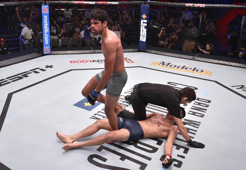 Aalon Cruz celebrates after knocking out Steven Nguyen in their featherweight fight during Dana White's Contender Series Week Six at the UFC Apex on July 30, 2019 in Las Vegas, Nevada. (Photo by Chris Unger/DWCS LLC/Zuffa LLC)