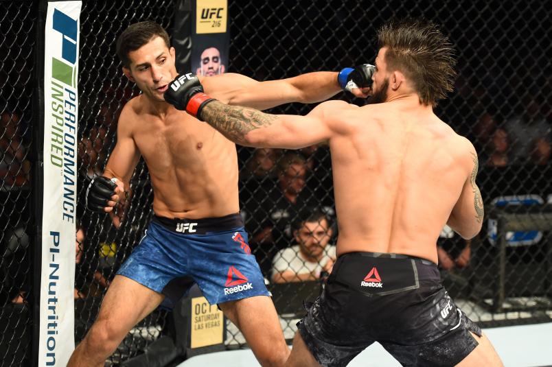 Alex Reyes and Mike Perry exchange punches in their welterweight bout during the UFC Fight Night event inside the PPG Paints Arena on September 16, 2017 in Pittsburgh, Pennsylvania. (Photo by Josh Hedges/Zuffa LLC via Getty Images)