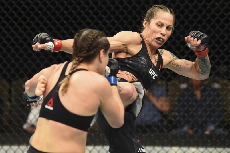 Liz Carmouche kicks Jennifer Maia of Brazil in their women's flyweight fight during the UFC Fight Night event inside CenturyLink Arena on July 14, 2018 in Boise, Idaho. (Photo by Josh Hedges/Zuffa LLC via Getty Images)