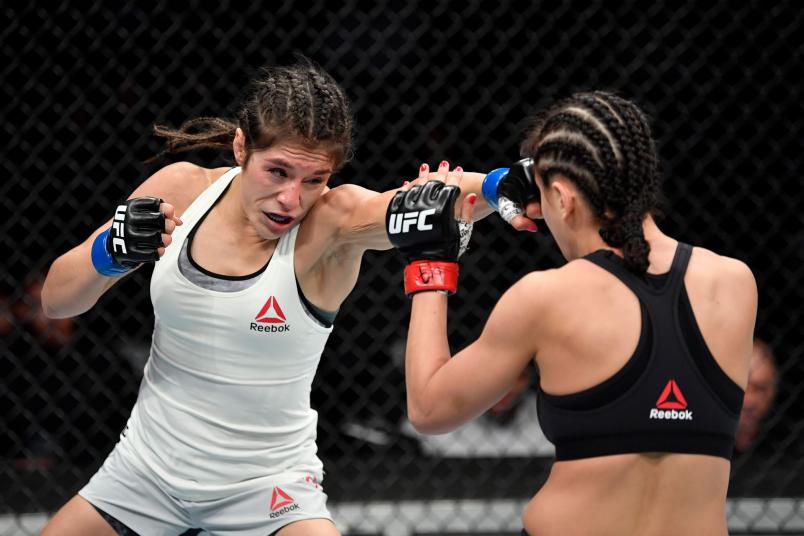 Alexa Grasso of Mexico punches Karolina Kowalkiewicz of Poland in their women's strawweight bout during the UFC 238 event at the United Center on June 8, 2019 in Chicago, Illinois. (Photo by Jeff Bottari/Zuffa LLC/Zuffa LLC via Getty Images)